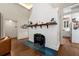Living room with painted brick fireplace and mantel shelf detail at 1181 Fairview Ne Rd, Atlanta, GA 30306