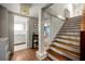 Staircase with hardwood steps and a bathroom featuring a white vanity and neutral wall paint at 1181 Fairview Ne Rd, Atlanta, GA 30306