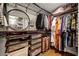 Spacious walk-in closet with custom shelves, hanging rods, and ample storage for clothes and accessories at 1181 Fairview Ne Rd, Atlanta, GA 30306
