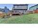 Expansive backyard with a deck, fence, and lawn, ideal for outdoor activities and relaxation at 200 Mona Ct, Lawrenceville, GA 30044