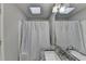 Neutral bathroom with granite countertop and a shower with white curtain at 200 Mona Ct, Lawrenceville, GA 30044