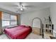 Relaxing bedroom with natural light, ceiling fan, and large window at 200 Mona Ct, Lawrenceville, GA 30044