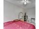 A simple bedroom with a large mirror, a ceiling fan, and neutral-toned walls at 200 Mona Ct, Lawrenceville, GA 30044