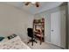 Cozy bedroom with a ceiling fan and a wooden bookshelf with a built-in desk at 200 Mona Ct, Lawrenceville, GA 30044