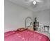 A simple bedroom with a large mirror, a ceiling fan, and neutral-toned walls at 200 Mona Ct, Lawrenceville, GA 30044
