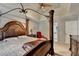 Spacious main bedroom features a four-poster bed, ceiling fan, and ensuite bathroom access at 200 Mona Ct, Lawrenceville, GA 30044
