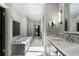 Expansive bathroom with marble counters, white marble floors, and oversized soaking tub at 2525 Peachtree Rd # 28, Atlanta, GA 30305