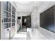 Bathroom with tiled floors features a soaking tub and view of the vanity area at 2525 Peachtree Rd # 28, Atlanta, GA 30305