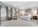 Serene main bedroom with striped walls, large windows, and comfortable bedding, creating a relaxing retreat at 2525 Peachtree Rd # 28, Atlanta, GA 30305