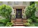 Elegant double doors with a covered porch and beautiful landscaping provide a welcoming entrance at 2525 Peachtree Rd # 28, Atlanta, GA 30305