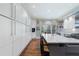 Spacious kitchen featuring white cabinets, a large island, and hardwood flooring at 2525 Peachtree Rd # 28, Atlanta, GA 30305