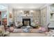 Classic living room with fireplace, decorative cabinets, and plush seating offering a refined and comfortable setting at 2525 Peachtree Rd # 28, Atlanta, GA 30305