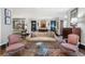 Open living room with a comfortable couch, decorative screens, and bright natural light at 2525 Peachtree Rd # 28, Atlanta, GA 30305