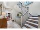 Elegant staircase with patterned carpet runner, white railings, and grey accents at 2525 Peachtree Rd # 28, Atlanta, GA 30305