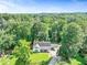 Aerial view of home on a large lot surrounded by mature trees at 2896 Tiffany Cir, Lawrenceville, GA 30044