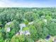 An aerial view showcasing a home encompassed by verdant mature trees, providing a sense of seclusion at 2896 Tiffany Cir, Lawrenceville, GA 30044