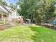 Well-maintained backyard with stone retaining walls, a deck, and patio at 2896 Tiffany Cir, Lawrenceville, GA 30044