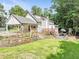Large backyard with patio, deck, lush lawn, and mature trees at 2896 Tiffany Cir, Lawrenceville, GA 30044