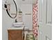 Bathroom featuring a pedestal sink and strawberry themed shower curtain at 2896 Tiffany Cir, Lawrenceville, GA 30044