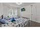 Bright bedroom featuring 2 twin beds, a window, and mounted television at 2896 Tiffany Cir, Lawrenceville, GA 30044