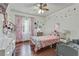 Bright bedroom featuring hardwood floors and whimsical decor at 2896 Tiffany Cir, Lawrenceville, GA 30044