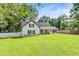 Beautiful home with lush lawn, and a white picket fence. Inviting, scenic exterior at 2896 Tiffany Cir, Lawrenceville, GA 30044
