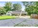 Charming home with a long driveway and a well-maintained, expansive front yard at 2896 Tiffany Cir, Lawrenceville, GA 30044