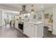 Modern kitchen boasts an island, stainless steel hood, and pendant lighting at 2896 Tiffany Cir, Lawrenceville, GA 30044