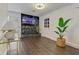 Cozy living room features stone accent wall, TV, and ample natural light at 2896 Tiffany Cir, Lawrenceville, GA 30044