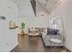 Bright living room with vaulted ceilings, gray sofa, gold accents, and hardwood floors at 2896 Tiffany Cir, Lawrenceville, GA 30044