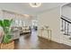 Inviting living room with hardwood floors, gray sofa, bright natural light, and staircase in view at 2896 Tiffany Cir, Lawrenceville, GA 30044