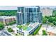 Overhead angle of the condominium with a pool, tennis court, and manicured green spaces at 2425 Peachtree Rd # 1806, Atlanta, GA 30305