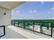 Lovely balcony view showcases lush greenery with neighborhood buildings on a bright sunny day at 2425 Peachtree Rd # 1806, Atlanta, GA 30305