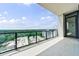 Wonderful balcony view showcases lush greenery with neighborhood buildings and blue skies at 2425 Peachtree Rd # 1806, Atlanta, GA 30305