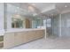 Modern bathroom featuring double vanity, large mirrors, and frameless glass shower at 2425 Peachtree Rd # 1806, Atlanta, GA 30305