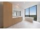 Spa-like bathroom with natural light, soaking tub, and double vanity at 2425 Peachtree Rd # 1806, Atlanta, GA 30305