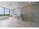 Large bathroom with walk-in shower, soaking tub, double vanities, and scenic views at 2425 Peachtree Rd # 1806, Atlanta, GA 30305