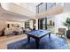 Comfortable billiard room area featuring a stylish pool table, ample seating, and an abundance of natural light at 2425 Peachtree Rd # 1806, Atlanta, GA 30305