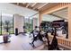 Well-appointed fitness center with stationary bikes and floor to ceiling windows with an outdoor view at 2425 Peachtree Rd # 1806, Atlanta, GA 30305