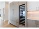Modern kitchen with stainless steel wine cooler and hardwood floors at 2425 Peachtree Rd # 1806, Atlanta, GA 30305