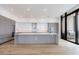 Spacious modern kitchen featuring white cabinets, stainless steel appliances, and a large island at 2425 Peachtree Rd # 1806, Atlanta, GA 30305