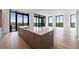 Sleek, modern kitchen with a large island and floor-to-ceiling windows at 2425 Peachtree Rd # 1806, Atlanta, GA 30305