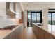 Modern kitchen with a large island, stainless steel appliances, and city view at 2425 Peachtree Rd # 1806, Atlanta, GA 30305