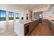 Modern kitchen with a large island, stainless steel appliances, and hardwood floors at 2425 Peachtree Rd # 1806, Atlanta, GA 30305