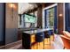 Chic resident lounge with a bar area, cozy seating, and modern entertainment options at 2425 Peachtree Rd # 1806, Atlanta, GA 30305
