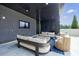 Comfortable outdoor lounge area with sleek furniture, a large screen TV, and stylish design, creating a relaxing space at 2425 Peachtree Rd # 1806, Atlanta, GA 30305