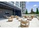 Inviting outdoor seating area with comfortable chairs, sofas, and a fire pit, perfect for entertaining guests at 2425 Peachtree Rd # 1806, Atlanta, GA 30305
