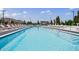 Large luxurious swimming pool with ample lounge chairs and city views at 2425 Peachtree Rd # 1806, Atlanta, GA 30305