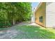 A large yard, framed by mature trees, extends from the house at 260 Redding Rdg, Atlanta, GA 30349