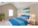 Comfortable bedroom with a vaulted ceiling, a large bed, and natural light from the window at 260 Redding Rdg, Atlanta, GA 30349